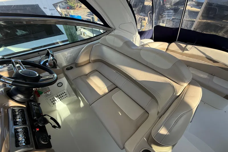 Slide: The Image of Interior of 2016 Formula 37 Performance Cruiser with beige seating and steering controls. - 9