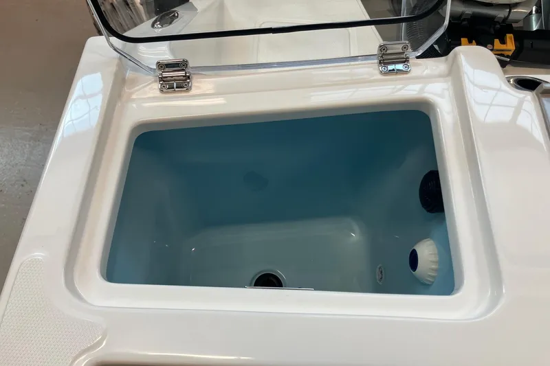 Slide: The Image of Livewell compartment on a 2026 Boston Whaler 330 Vantage boat, open lid view. - 11