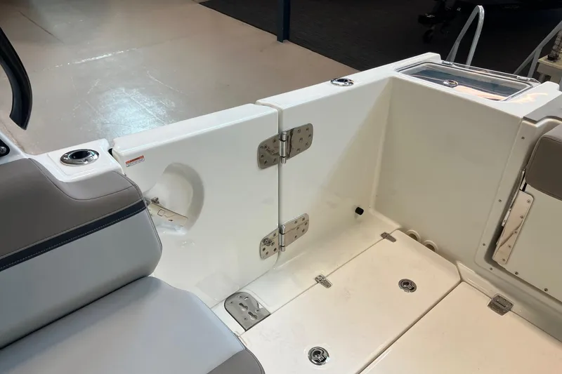 Slide: The Image of 2026 Boston Whaler 330 Vantage boat interior, featuring seating and storage compartments. - 14