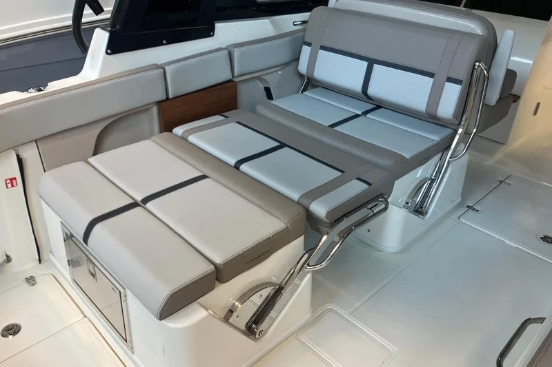 Slide: The Image of 2026 Boston Whaler 330 Vantage interior seating with adjustable backrest and sleek design. - 16
