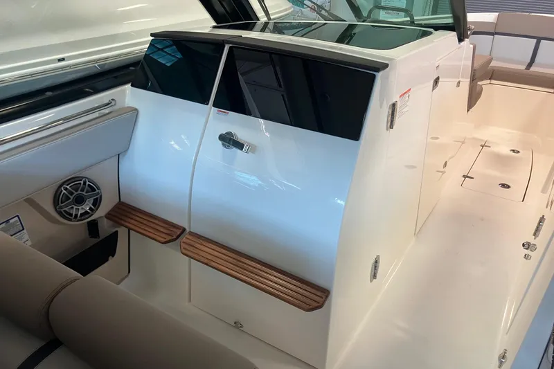 Slide: The Image of 2026 Boston Whaler 330 Vantage interior with seating and speaker detail. - 22