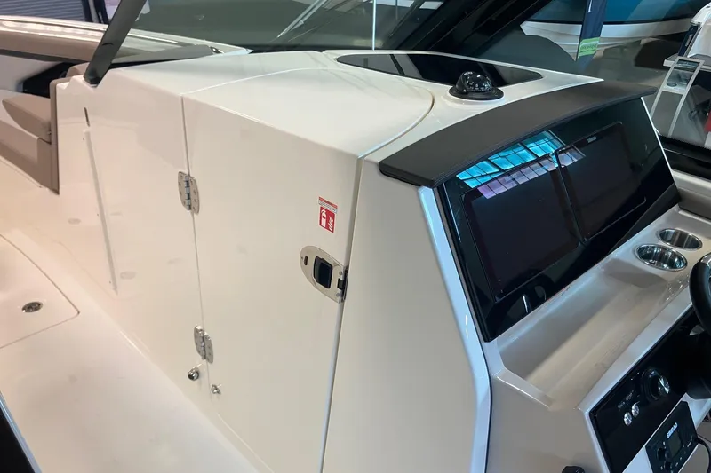 Slide: The Image of 2026 Boston Whaler 330 Vantage boat interior with sleek dashboard and modern controls. - 24