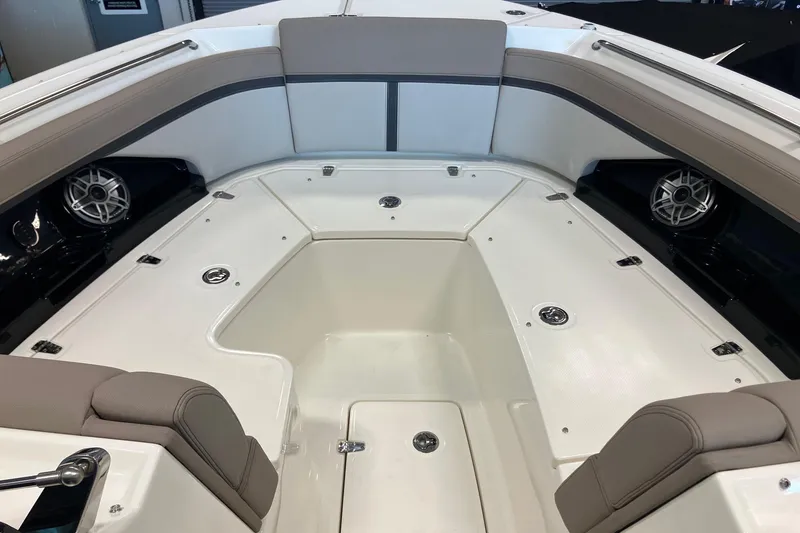 Slide: The Image of 2026 Boston Whaler 330 Vantage boat interior with seating and speakers. - 26
