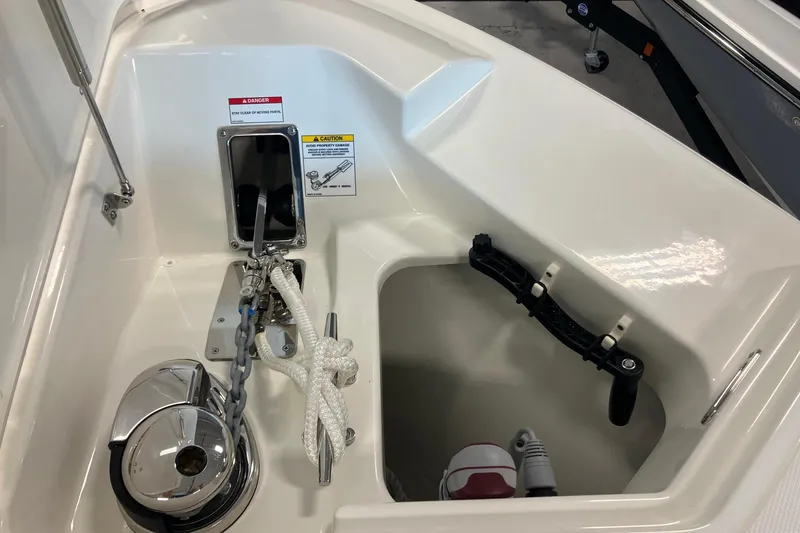 Slide: The Image of Anchor compartment of 2026 Boston Whaler 330 Vantage boat with chain and rope. - 28