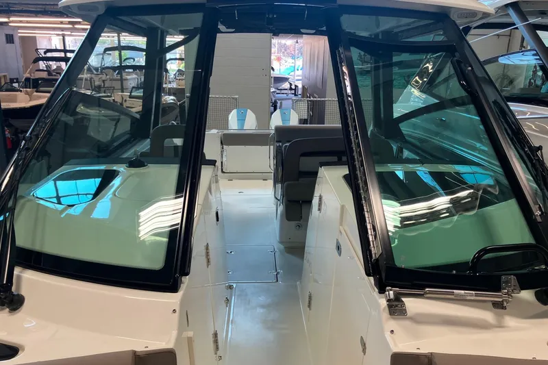 Slide: The Image of 2026 Boston Whaler 330 Vantage boat interior with sleek design and spacious seating. - 29