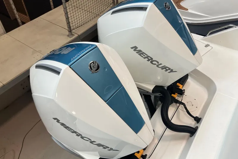 Slide: The Image of Twin Mercury outboard engines on a 2026 Boston Whaler 330 Vantage boat. - 4