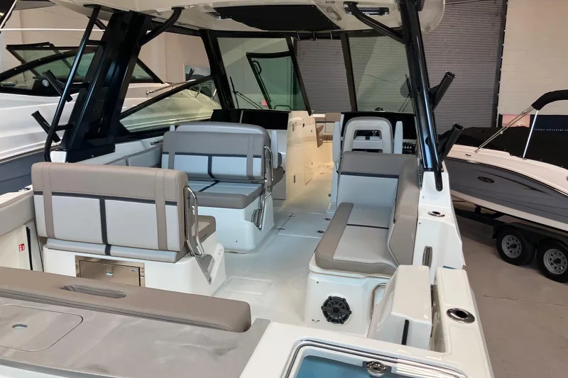 Slide: The Image of 2026 Boston Whaler 330 Vantage boat interior with seating and modern design. - 6