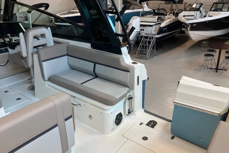Slide: The Image of Interior view of 2026 Boston Whaler 330 Vantage boat with seating and controls. - 7