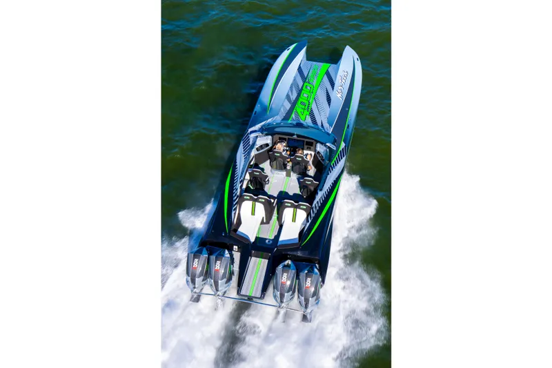 Slide: The Image of 2026 Nor-Tech 4000 Roadster speedboat cruising on water, featuring powerful engines and sleek design. - 5