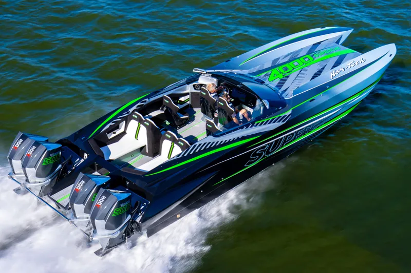 Slide: The Image of 2026 Nor-Tech 4000 Roadster speedboat cruising on water, featuring sleek design and powerful engines. - 6