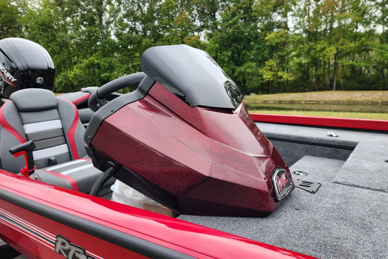 Slide: The Image of 2026 Ranger RT178 boat with red console and gray seats, set against a lush green backdrop. - 10