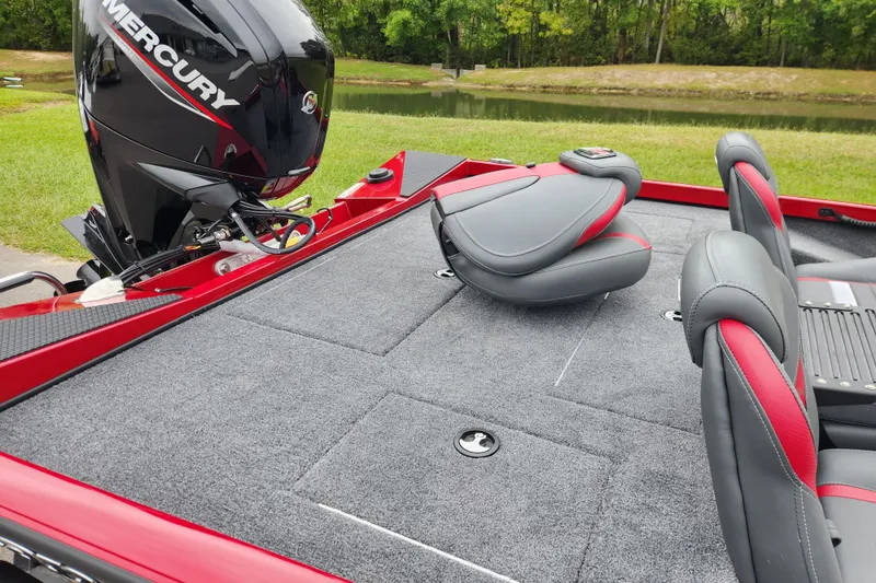 Slide: The Image of 2026 Ranger RT178 boat with Mercury engine, featuring spacious seating and carpeted deck. - 13