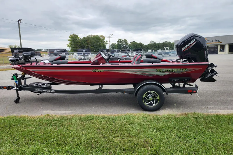 Slide: The Image of 2026 Ranger RT178 boat in red on a trailer, parked outdoors. - 5