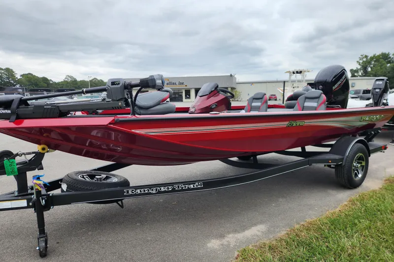 Slide: The Image of 2026 Ranger RT178 boat in red on a trailer, parked outdoors. - 6