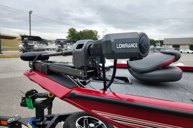 Slide: The Image of 2026 Ranger RT178 boat with Lowrance equipment, red exterior, parked outdoors. - 7