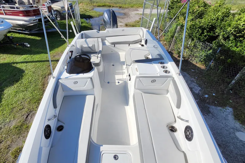 Slide: The Image of 2023 Hurricane SunDeck Sport 205 OB boat interior with seating and cup holders. - 17