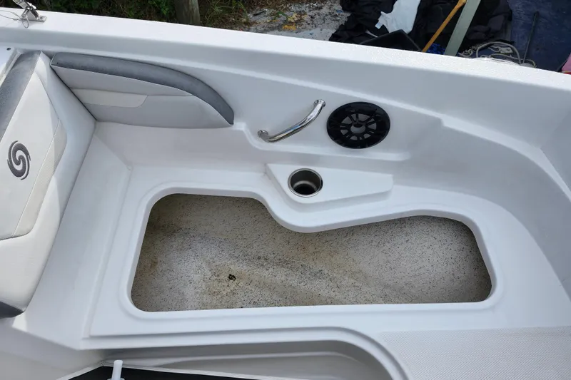 Slide: The Image of 2023 Hurricane SunDeck Sport 205 OB boat interior with seating and speaker. - 20