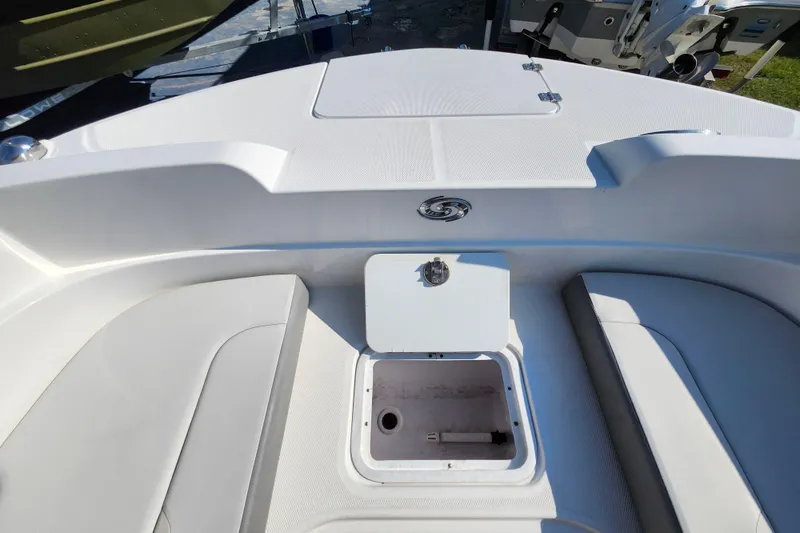 Slide: The Image of 2023 Hurricane SunDeck Sport 205 OB boat interior with open storage compartment. - 8