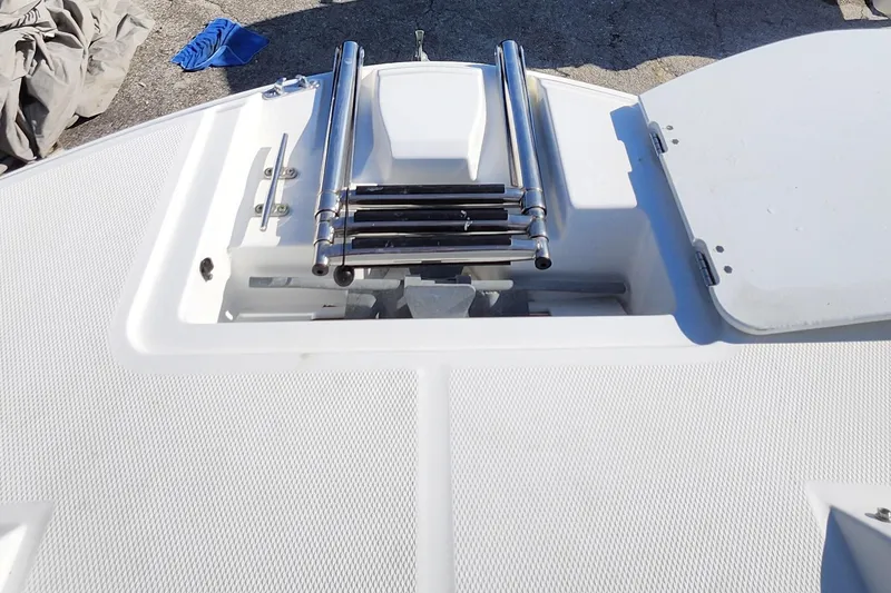 Slide: The Image of 2023 Hurricane SunDeck Sport 205 OB boat deck with stainless steel ladder. - 9
