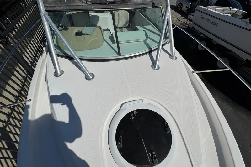 Slide: The Image of 2012 Wellcraft 210 Coastal boat deck with windshield and railing, viewed from above. - 22