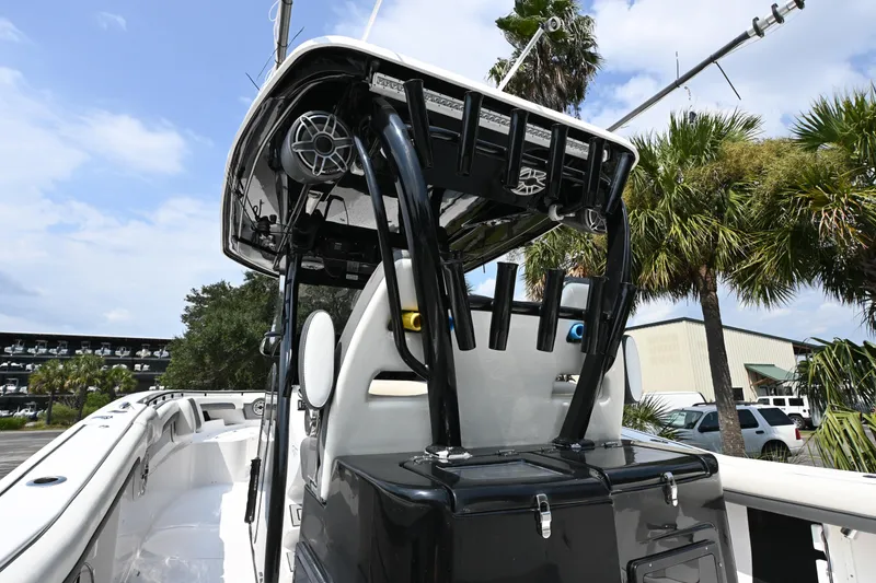 Slide: The Image of Control panel of 2020 Tidewater 320 CC Adventure boat with throttle and buttons. - 12