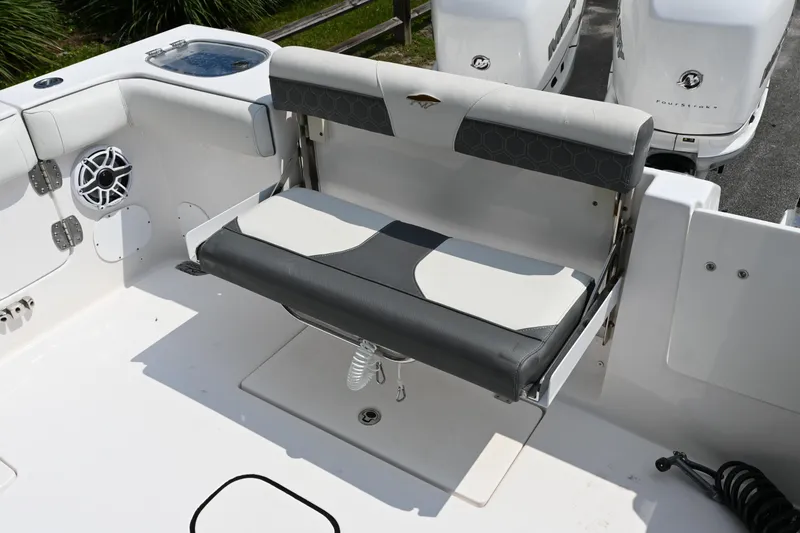 Slide: The Image of 2020 Tidewater 320 CC Adventure boat with foldable seating and dual outboard motors. - 21