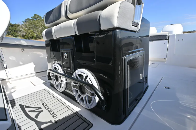 Slide: The Image of 2020 Tidewater 320 CC Adventure boat interior with seating and storage compartments. - 29