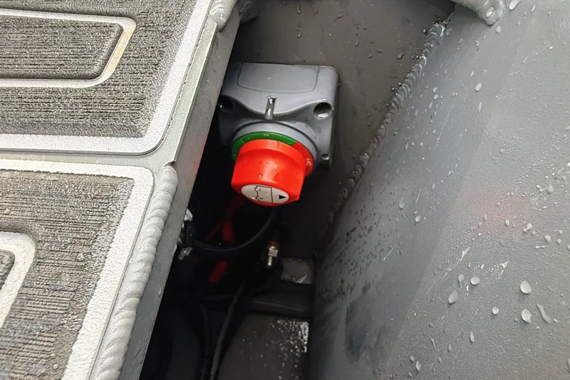 Slide: The Image of Red switch in Reaper Boats 550, 2024 model, with textured flooring and water droplets. - 10