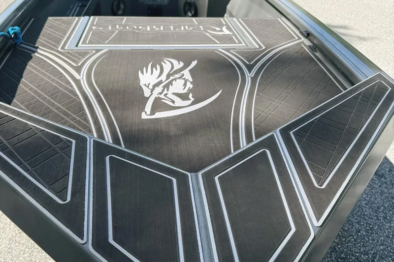 Slide: The Image of Yamaha SHO VMAX outboard motor on 2024 Reaper Boats 550, parked on a sunny day. - 3