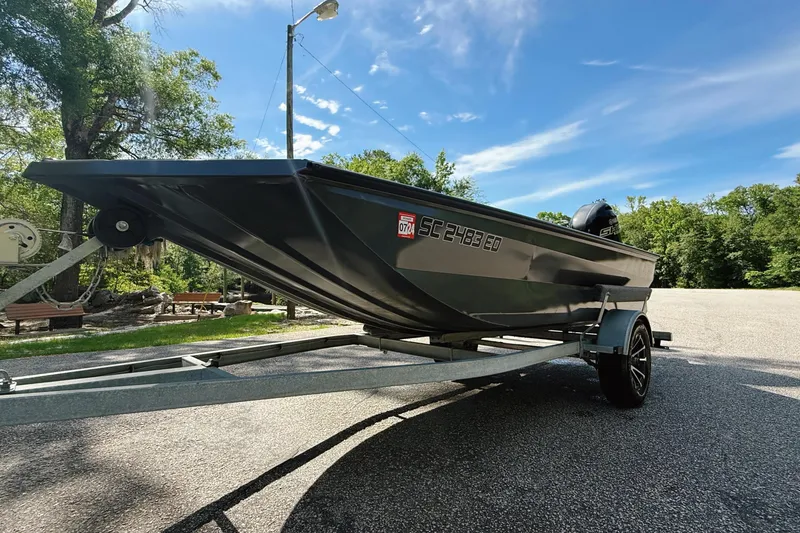 Slide: The Image of 2024 Reaper Boats 550 interior with Skar Audio speakers and stylish flooring design. - 8