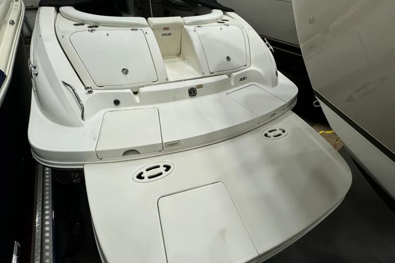 Slide: The Image of 2006 Sea Ray 290 Select EX boat stern view in storage. - 10