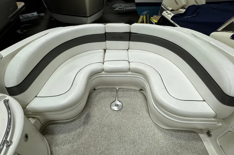 Slide: The Image of 2006 Sea Ray 290 Select EX boat interior with white and gray seating. - 12