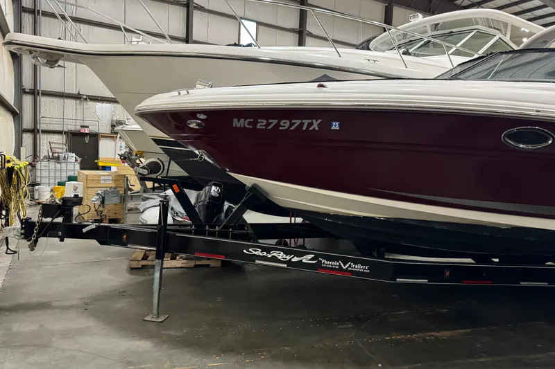 Slide: The Image of 2006 Sea Ray 290 Select EX boat on trailer in storage facility. - 2