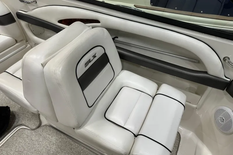 Slide: The Image of 2006 Sea Ray 290 Select EX interior with white leather seating and black accents. - 22
