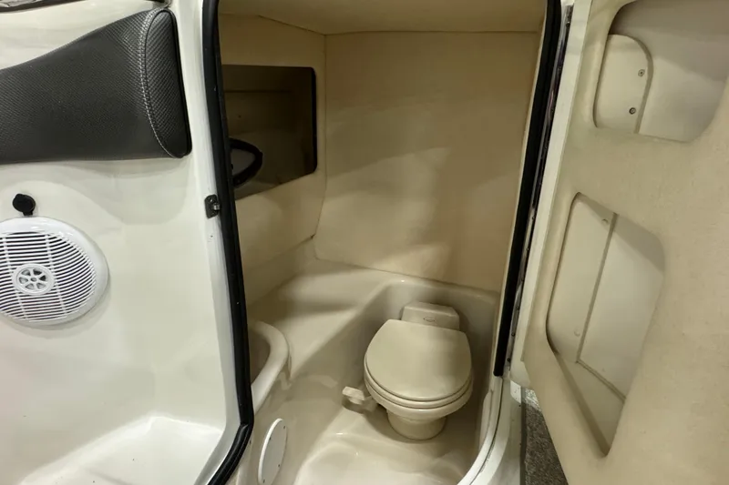 Slide: The Image of 2006 Sea Ray 290 Select EX boat interior with compact bathroom and toilet. - 25