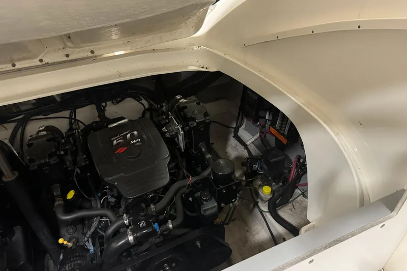 Slide: The Image of Engine compartment of a 2006 Sea Ray 290 Select EX boat, featuring MerCruiser MPI engine. - 28