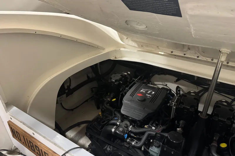 Slide: The Image of Engine compartment of a 2006 Sea Ray 290 Select EX boat, showcasing the MerCruiser engine. - 29
