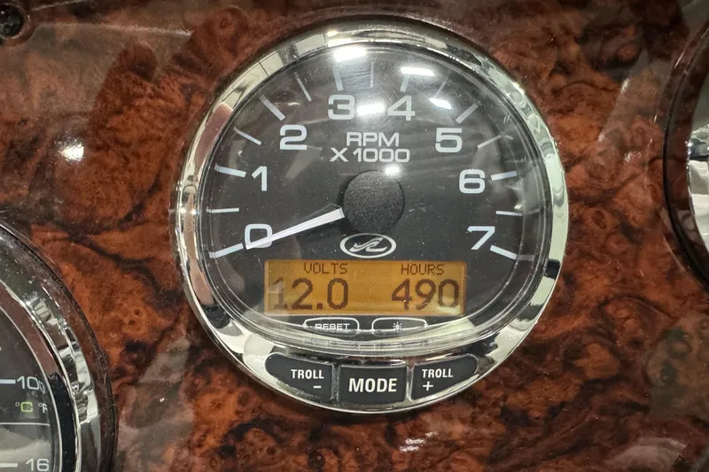 Slide: The Image of Tachometer of 2006 Sea Ray 290 Select EX showing 490 hours and 12 volts. - 30