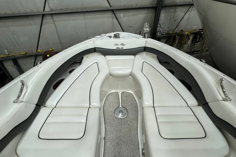 Slide: The Image of 2006 Sea Ray 290 Select EX boat interior with white seating and sleek design. - 33
