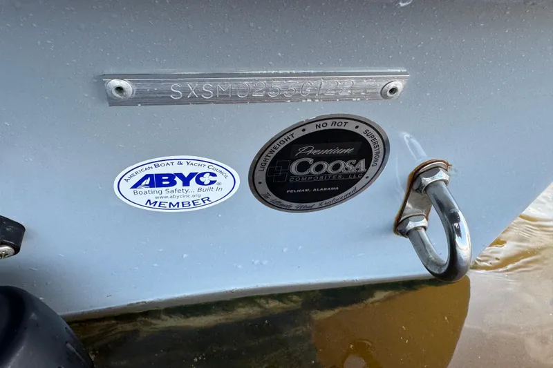 Slide: The Image of 2022 Sea Hunt Ultra 219 boat with ABYC and Coosa Composites labels. - 14