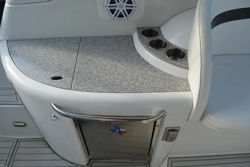 Slide: The Image of 2006 Formula 34 Performance Cruiser interior with cup holders and speaker. - 14