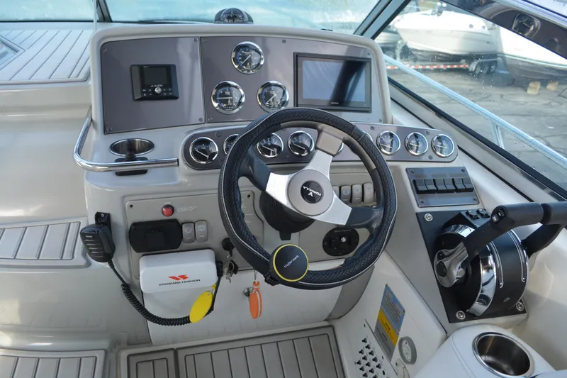 Slide: The Image of 2006 Formula 34 Performance Cruiser helm with steering wheel and control panel. - 15