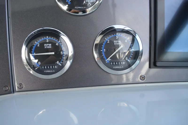 Slide: The Image of Dashboard of 2006 Formula 34 Performance Cruiser with RPM gauges. - 16