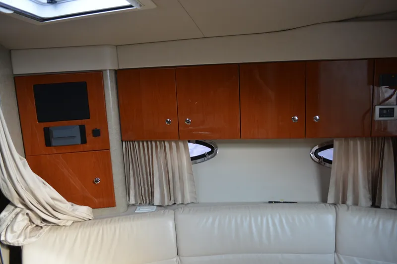 Slide: The Image of Interior of 2006 Formula 34 Performance Cruiser with wooden cabinets and porthole windows. - 20