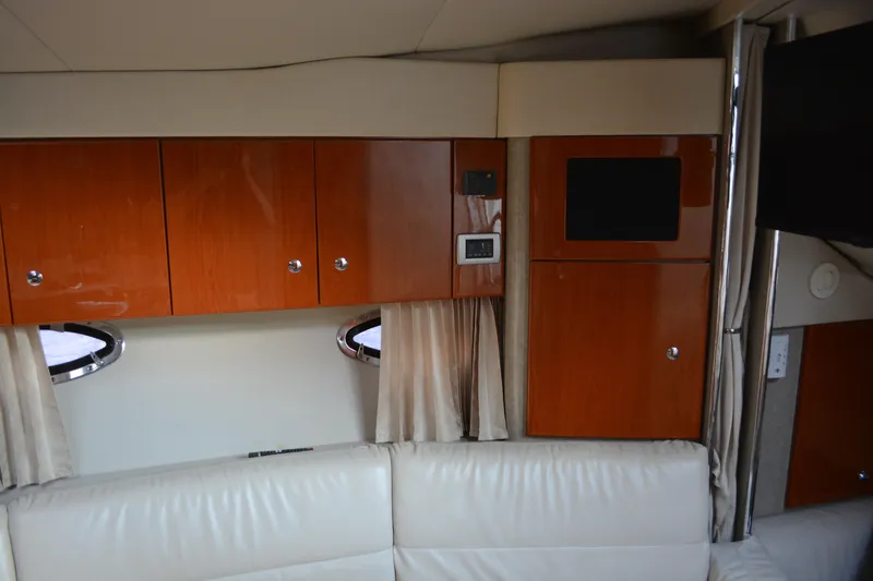 Slide: The Image of Interior of 2006 Formula 34 Performance Cruiser with wooden cabinets and white leather seating. - 21