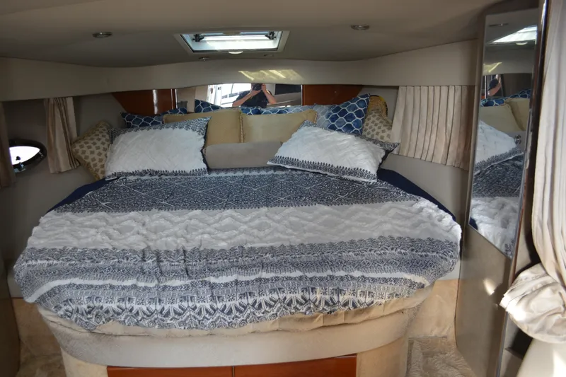 Slide: The Image of Interior cabin of 2006 Formula 34 Performance Cruiser with cozy bedding and pillows. - 26