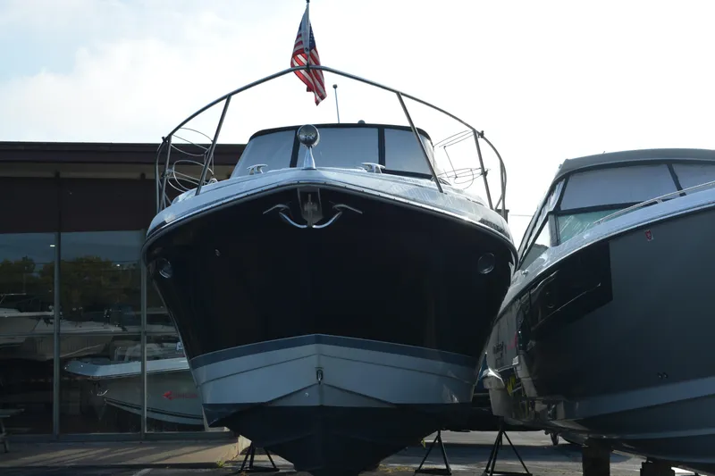 Slide: The Image of 2006 Formula 34 Performance Cruiser boat displayed outdoors with American flag. - 3