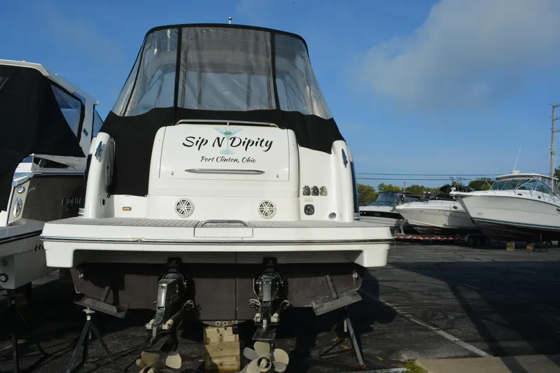 Slide: The Image of 2006 Formula 34 Performance Cruiser docked, rear view, with "Sip N Dipity" name visible. - 6