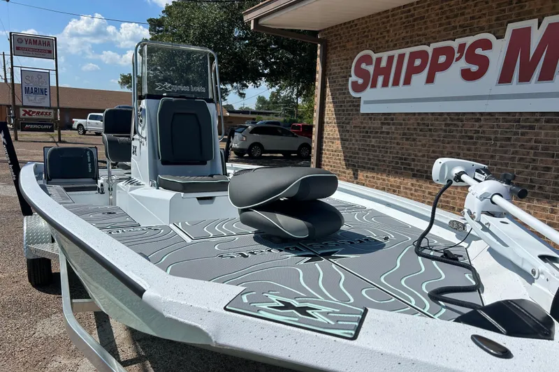 Slide: The Image of 2026 Xpress H20B Bay boat displayed at Shipp's Marine dealership. - 8