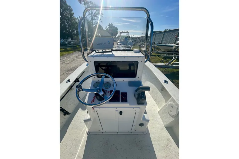 Slide: The Image of 2017 May-Craft 1800CC boat console with steering wheel and Garmin navigation system. - 5